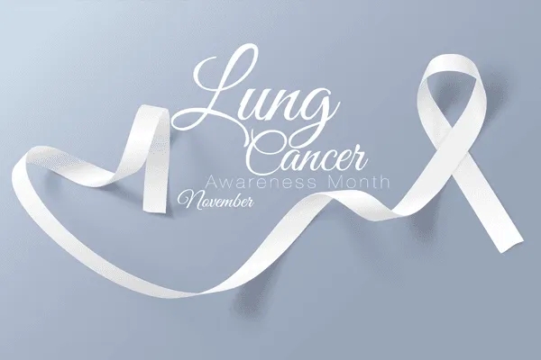 A white ribbon on a light blue background with text that reads 